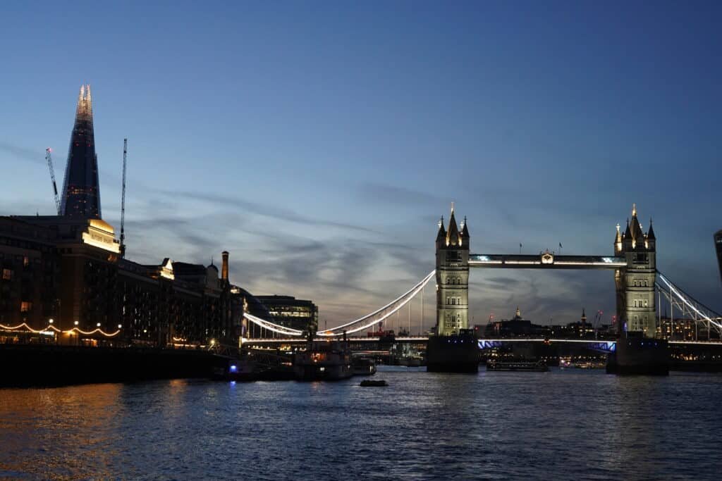 Tower Bridge and Shard at night from Thames River boat